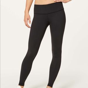 Lululemon black mid rise Wunder Under leggings.